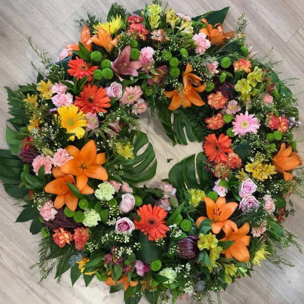 Corona de flores variadas de colores 90cm